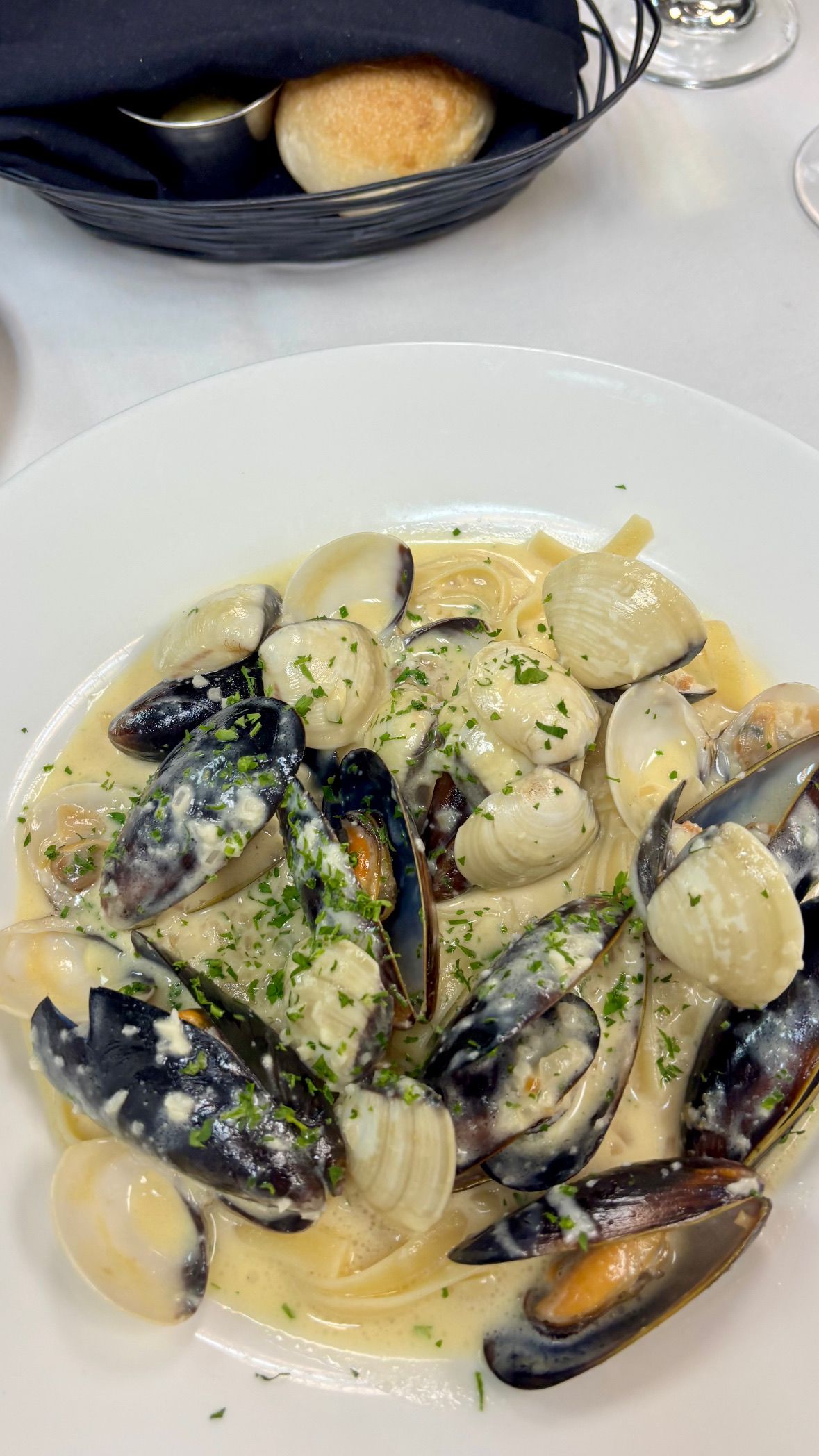 Mussel & Clam Fettucinne at Marigold Bistro in Colorado Springs, CO 80906 | YourMenu® Online Ordering