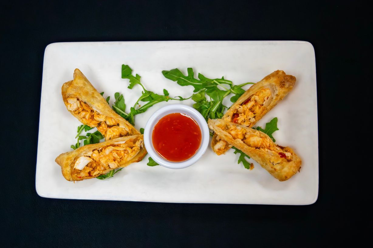 Spicy Chicken Eggrolls at Marigold Bistro in Colorado Springs, CO 80906 | YourMenu® Online Ordering