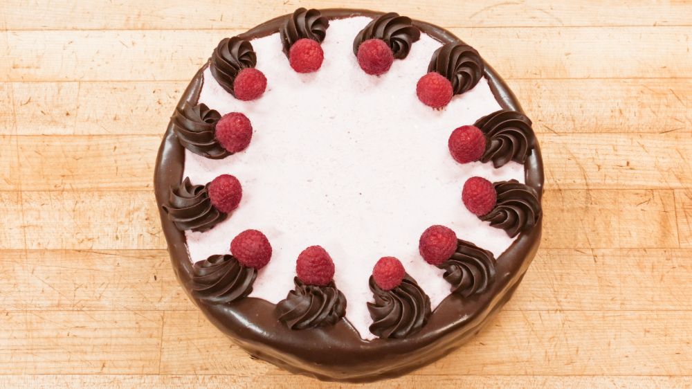 Chocolate Raspberry Mousse Cake at Marigold Cafe & Bakery - Cake Menu in Colorado Springs, CO 80919 | YourMenu® Online Ordering
