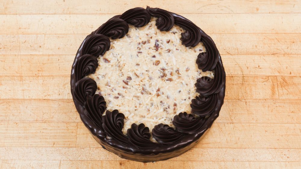 German Chocolate Mousse Cake at Marigold Cafe & Bakery - Cake Menu in Colorado Springs, CO 80919 | YourMenu® Online Ordering