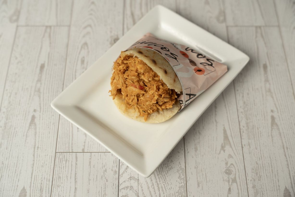 Arepa Venezolana con Pollo at Ajiacos Restaurant in Hallandale Beach, FL 33009 | YourMenu® Online Ordering