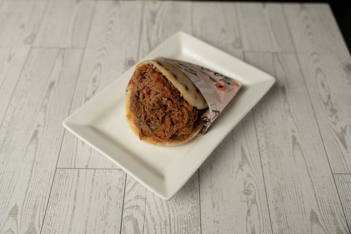 Arepa Venezolana Carne Mechada at Ajiacos Restaurant in Hallandale Beach, FL 33009 | YourMenu® Online Ordering