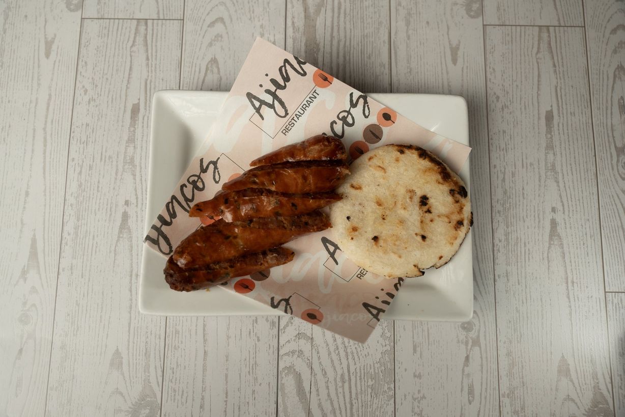 Chorizo con Arepita at Ajiacos Restaurant in Hallandale Beach, FL 33009 | YourMenu® Online Ordering