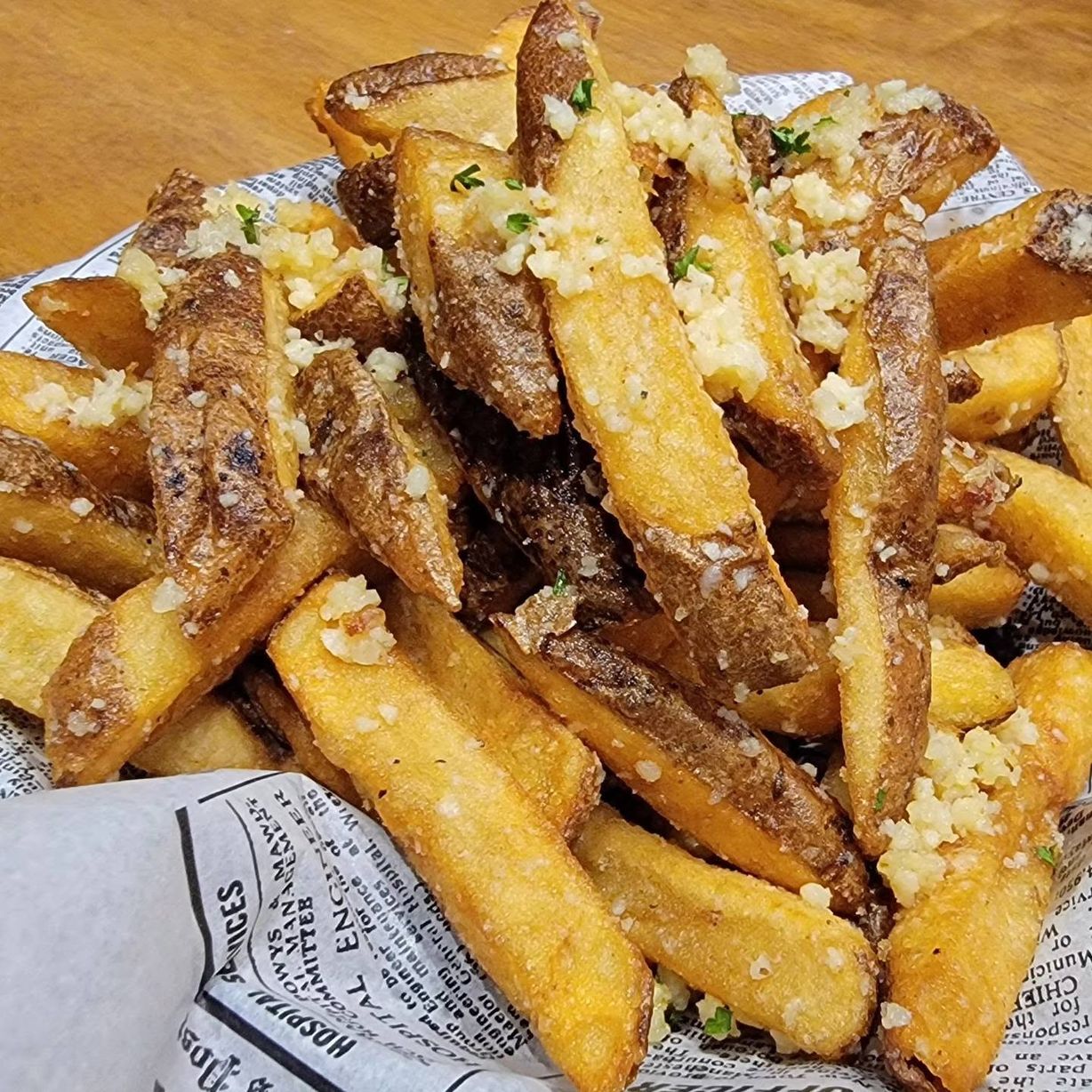 Garlic Parmesan Fries at The Exchange in Colorado Springs, CO 80903 | YourMenu® Online Ordering