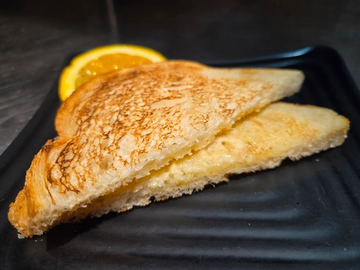 2 Slices of Toast or Brioche bun W/ Butter & 4 Berry Jam at The Exchange in Colorado Springs, CO 80903 | YourMenu® Online Ordering