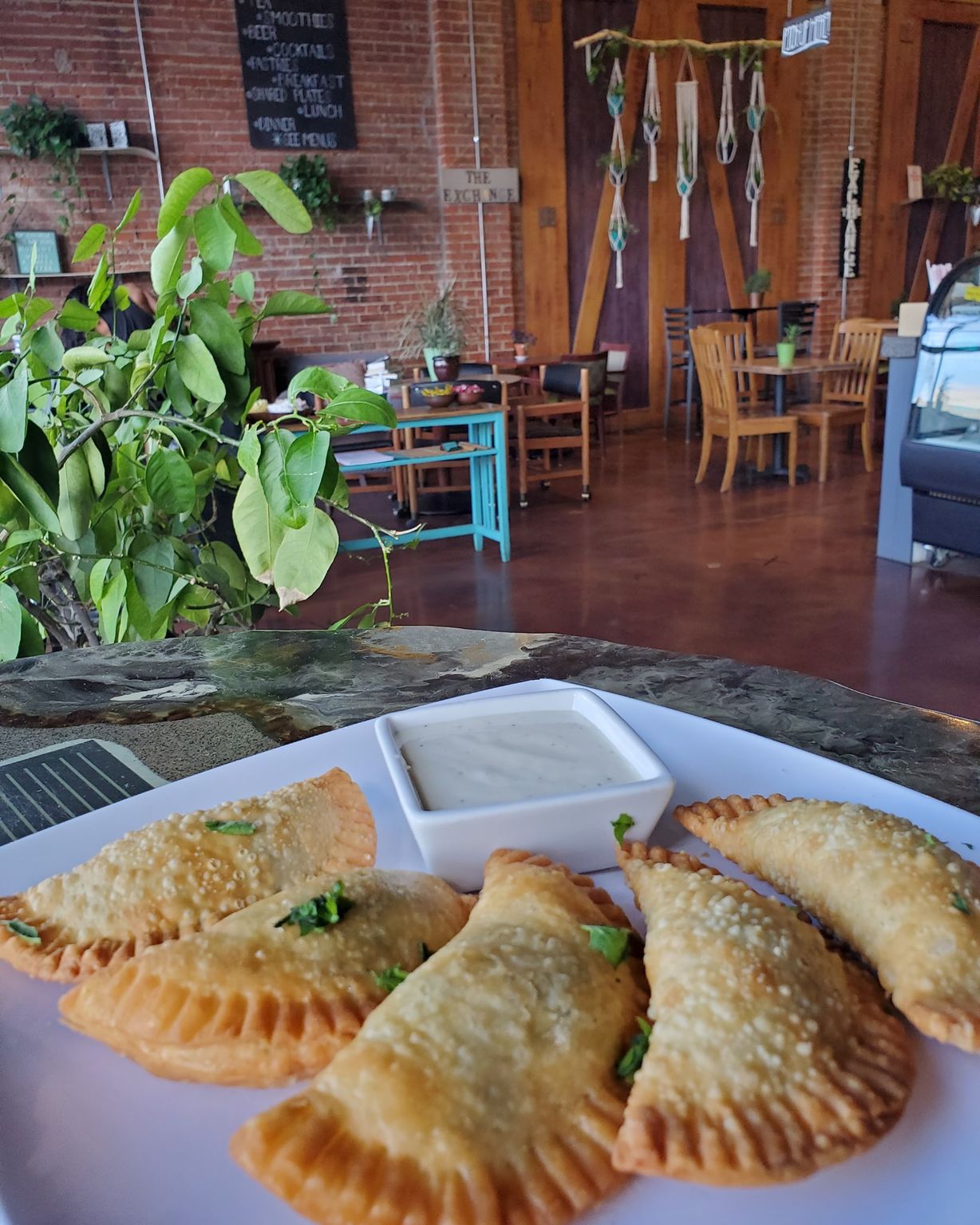 Spinach Artichoke Empanadas at The Exchange in Colorado Springs, CO 80903 | YourMenu® Online Ordering