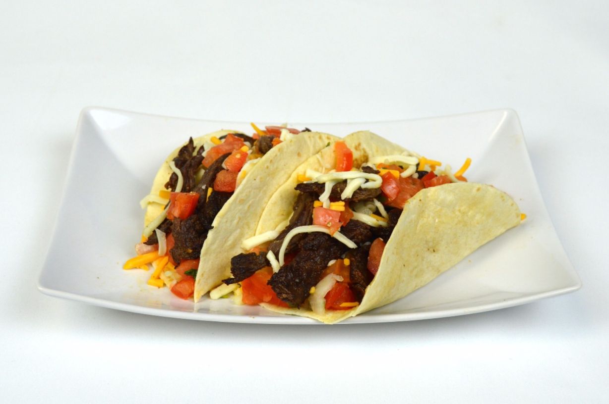 Tacos de carnitas/Pork tacos at El Patron Deli Mexicano and Salvadoreño in White Plains, MD 20695 | YourMenu® Online Ordering