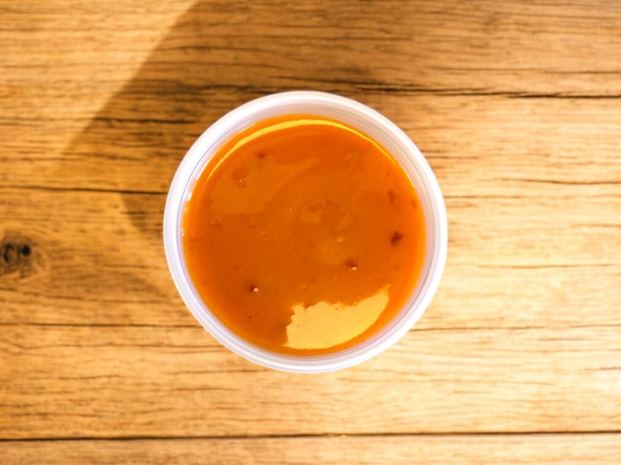 Side Sweet & Spicy Buffalo Sauce at Blowin' Smoke BBQ @ Prime Time Butcher in WOODBURY, NY 11797 | YourMenu® Online Ordering