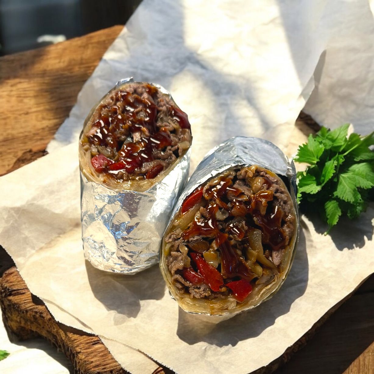 Sizzling Rib Eye Cheddar Wrap at Blowin' Smoke BBQ @ Prime Time Butcher in WOODBURY, NY 11797 | YourMenu® Online Ordering