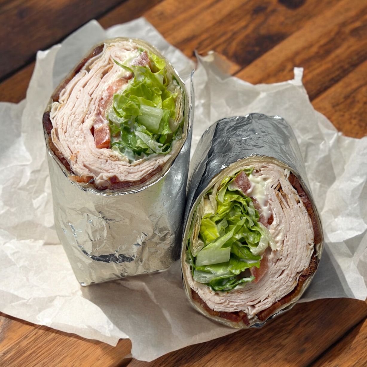 Roasted Turkey/Chicken BLT Wrap at Blowin' Smoke BBQ @ Prime Time Butcher in WOODBURY, NY 11797 | YourMenu® Online Ordering