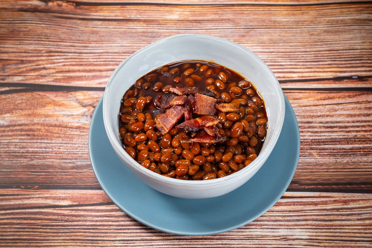 Pineapple Bourbon Baked Beans at Blowin' Smoke BBQ @ Prime Time Butcher in WOODBURY, NY 11797 | YourMenu® Online Ordering