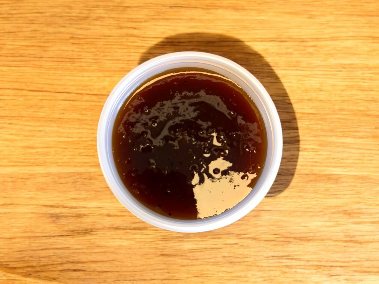 Side Pineapple Bourbon BBQ Sauce at Blowin' Smoke BBQ @ Prime Time Butcher in WOODBURY, NY 11797 | YourMenu® Online Ordering