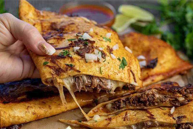 Quesadilla De Birria at Taco and Chelas in DORAL, FL 33166 | YourMenu® Online Ordering