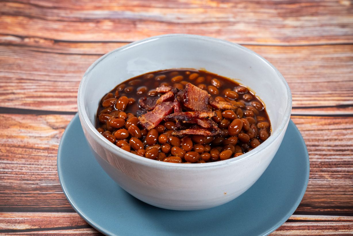 1/2 Tray - Pineapple Bourbon Baked Beans at Blowin' Smoke BBQ @ Prime Time Butcher | Catering in WOODBURY, NY 117971212 | YourMenu® Online Ordering