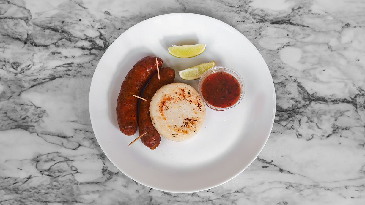 Chorizo Con Arepa at Atipicos Food in Riviera Beach, FL 33404 | YourMenu® Online Ordering