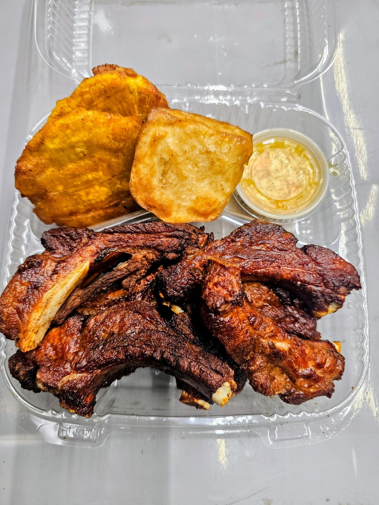 Fried Ribs Platter  at PAUL'S UNIQUE GOURMET in MIAMI, FL 33168 | YourMenu® Online Ordering