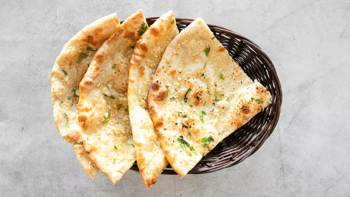 Garlic Cilantro Naan at Saffron Indian Cuisine in Marietta, GA 30066-7617 | YourMenu® Online Ordering