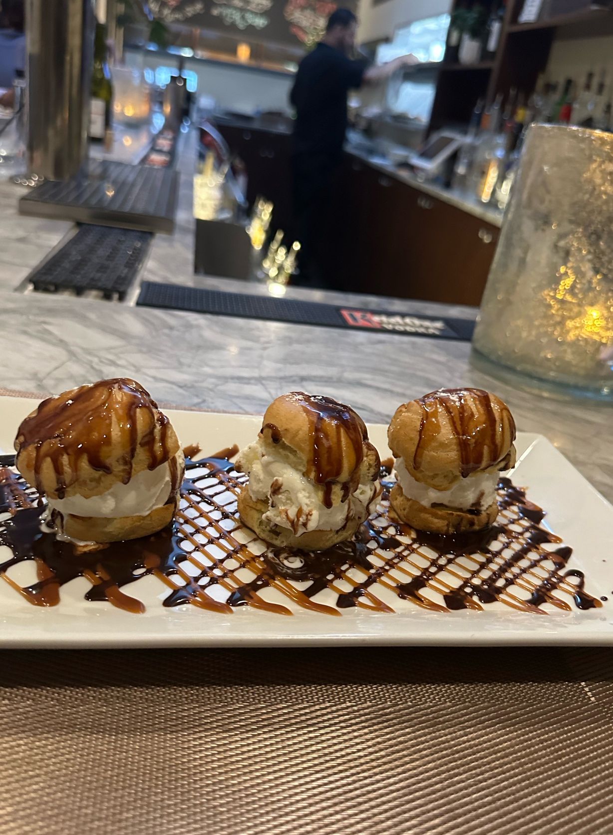 Profiteroles at Persimmon Restaurant in CHEVY CHASE, MD 20815 | YourMenu® Online Ordering