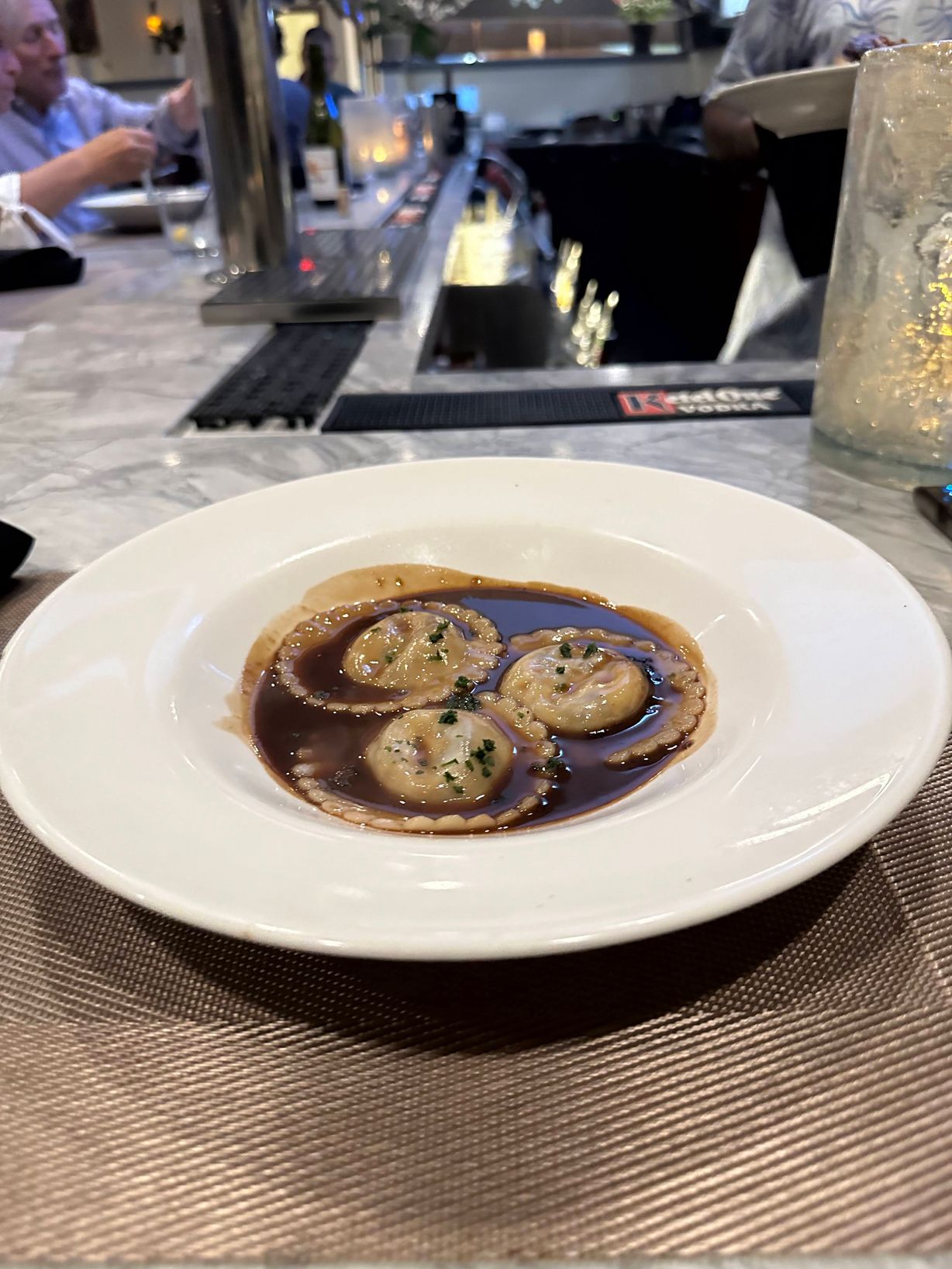 Ravioli at Persimmon Restaurant in CHEVY CHASE, MD 20815 | YourMenu® Online Ordering