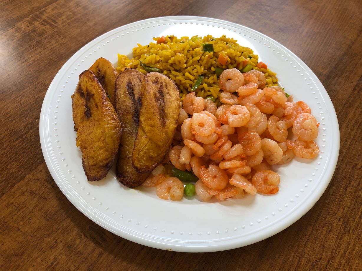 Fried rice w/ shrimps & a side at Jodeem African Cuisine in Greenbelt, MD 20770 | YourMenu® Online Ordering