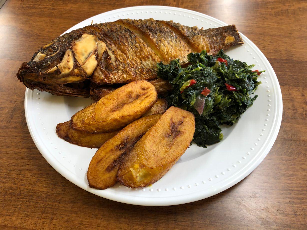 Whole fish w/ spinach & plantains at Jodeem African Cuisine in Greenbelt, MD 20770 | YourMenu® Online Ordering
