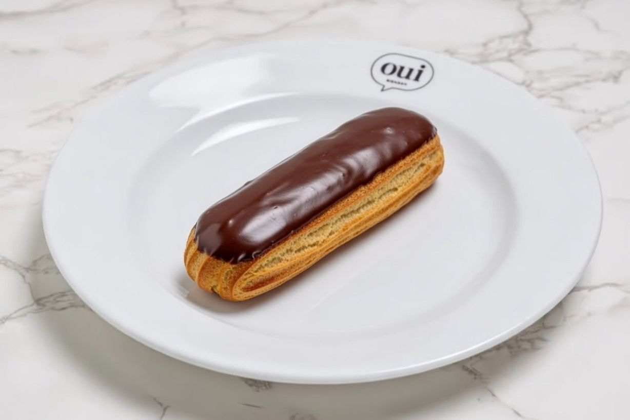 Chocolate Éclair at OUI Bistrot in Miami, FL 33137 | YourMenu® Online Ordering