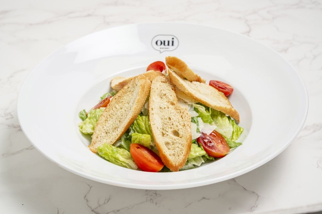 Caesar Salad at OUI BISTROT in Miami, FL 33137 | YourMenu® Online Ordering
