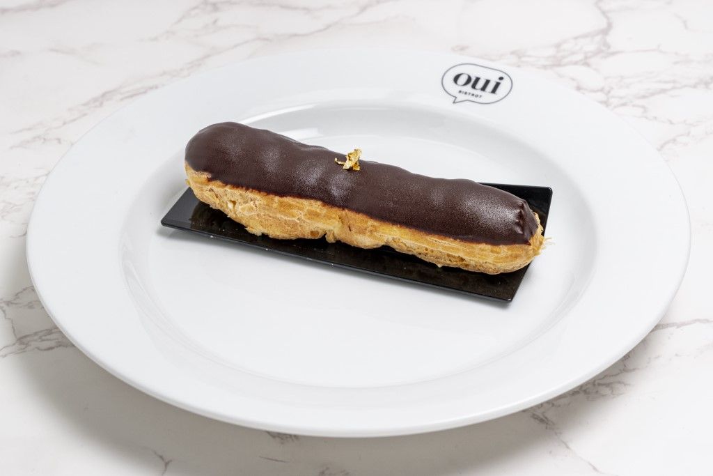 Chocolate Éclair at OUI BISTROT in Miami, FL 33137 | YourMenu® Online Ordering
