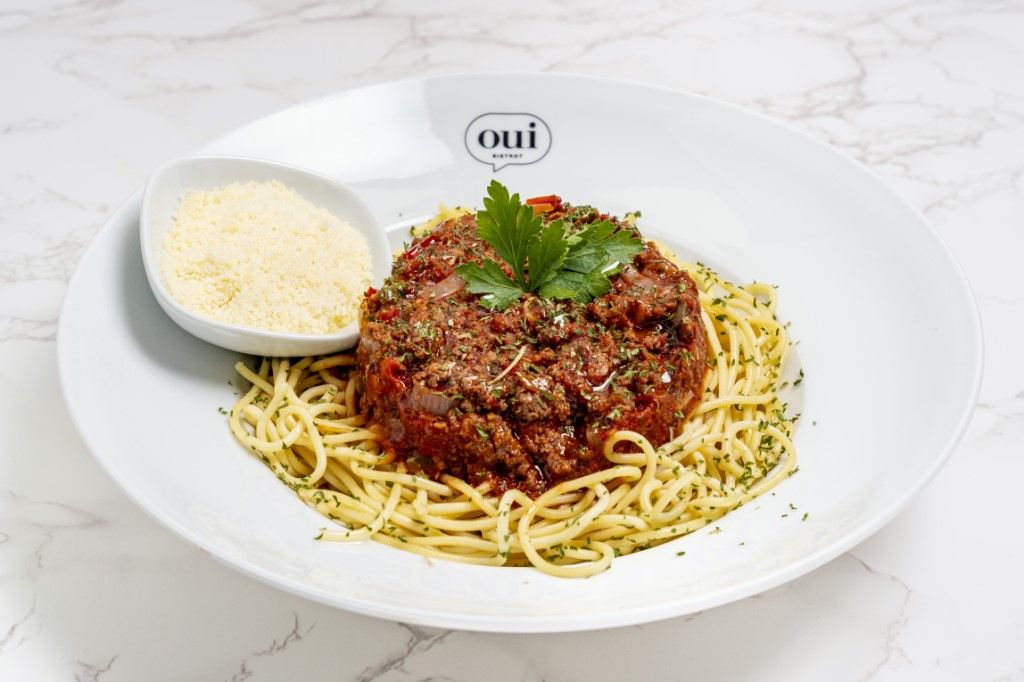 Spaghetti Bolognese at OUI BISTROT in Miami, FL 33137 | YourMenu® Online Ordering