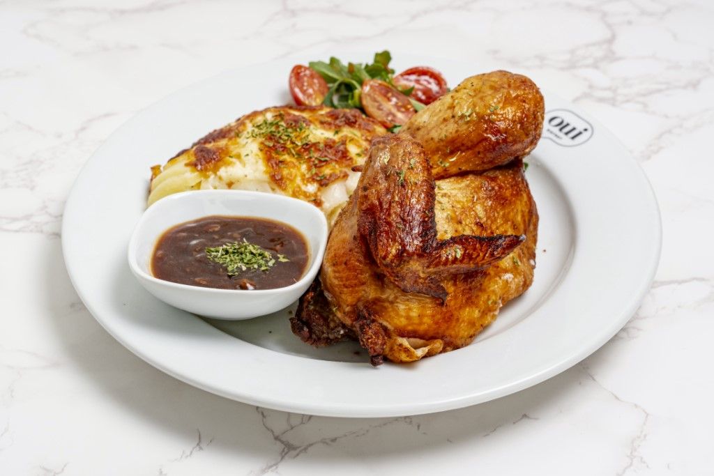 Half Roasted Chicken (with Gratin Dauphinois) at OUI BISTROT in Miami, FL 33137 | YourMenu® Online Ordering