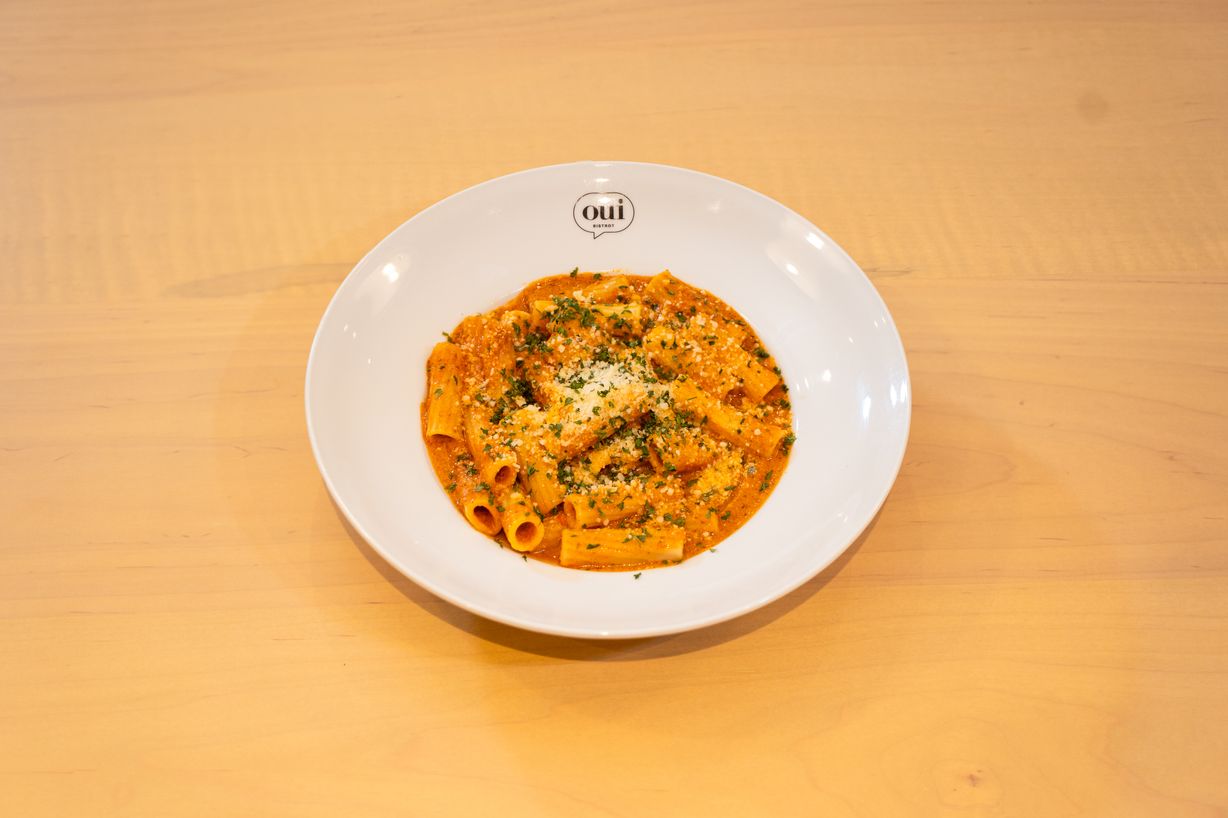 Spicy Rigatoni at OUI Bistrot in Miami, FL 33137 | YourMenu® Online Ordering