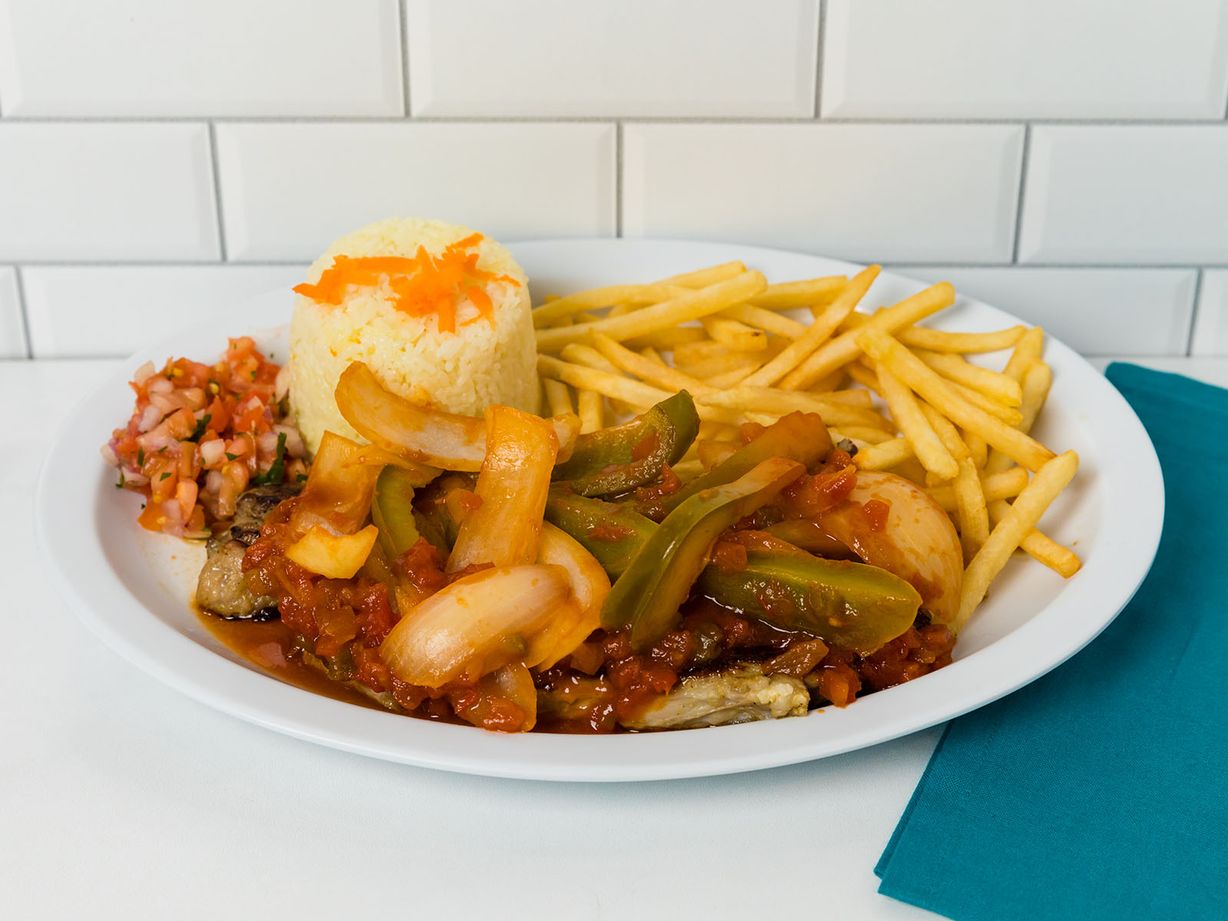 LOMO DE RES ENCEBOLLADO at Delicias La Cabaña in HIALEAH, FL 33012 | YourMenu® Online Ordering