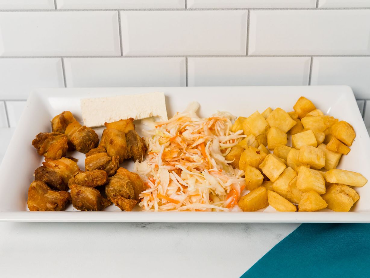 YUCA CON CHICHARRON at Delicias La Cabaña in HIALEAH, FL 33012 | YourMenu® Online Ordering