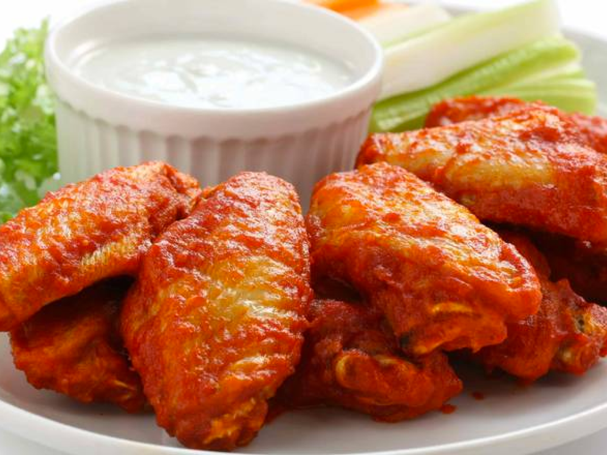 Alitas Con Papas Fritas (8) at Bohio Latin Flavors in Margate, FL 33063 | YourMenu® Online Ordering