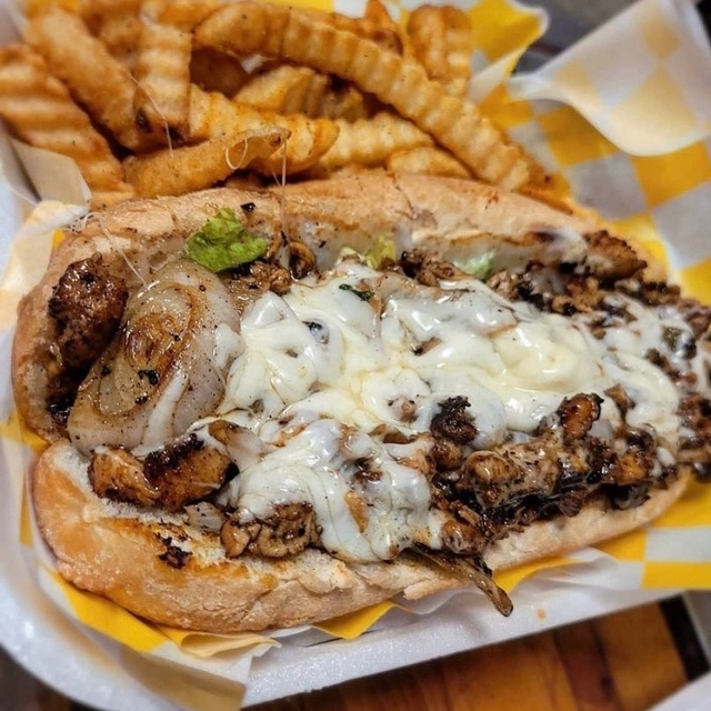 Jerk Chicken Poboy at 1693 Redzone Grill in Jackson, MS 39213 | YourMenu® Online Ordering
