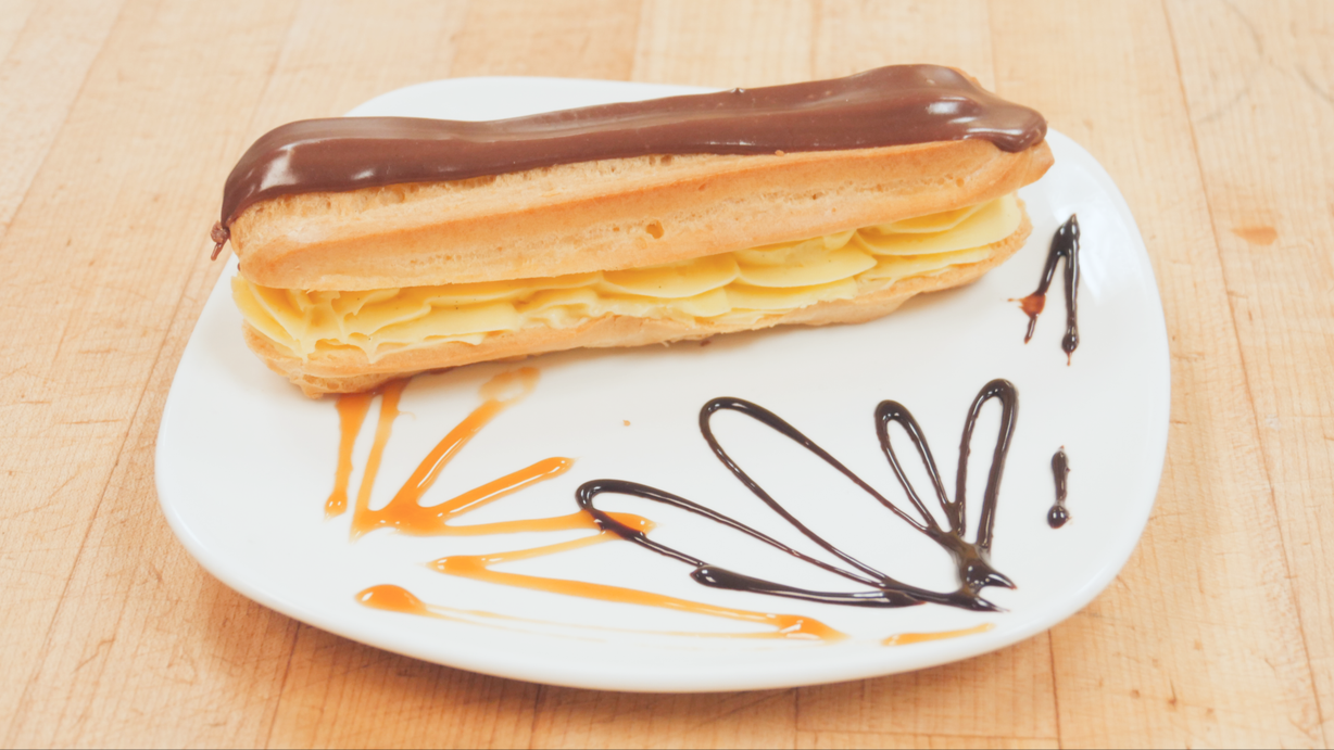 Chocolate Eclair at Marigold Cafe & Bakery in Colorado Springs, CO 80919 | YourMenu® Online Ordering