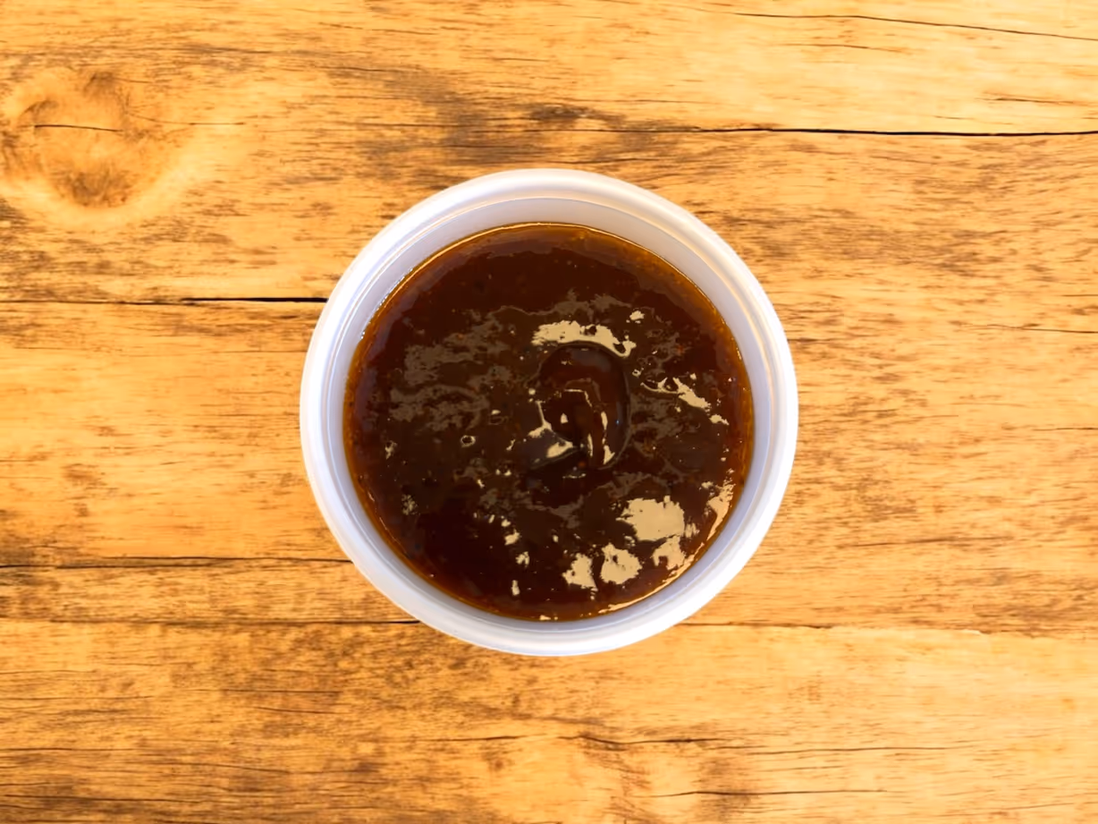 Side Charred Ancho Fig BBQ Glaze at Blowin' Smoke BBQ @ Prime Time Butcher in WOODBURY, NY 11797 | YourMenu Online Ordering