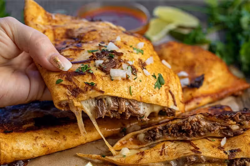 Quesadilla De Birria at Taco and Chelas in DORAL, FL 33166 | YourMenu Online Ordering Quesadilla De Birria at Taco and Chelas in DORAL, FL 33166 | YourMenu Online Ordering