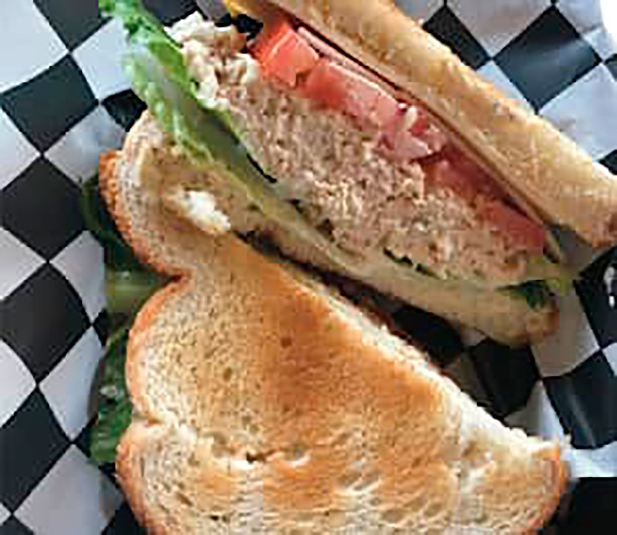 Tuna Albacore Sandwich ( Deli Bread, Swiss Cheese, Romaine, Tomato, Spring Mix) at Oakland Coffee & Juice Bar in OAKLAND PARK, FL 33334 | YourMenu Online Ordering