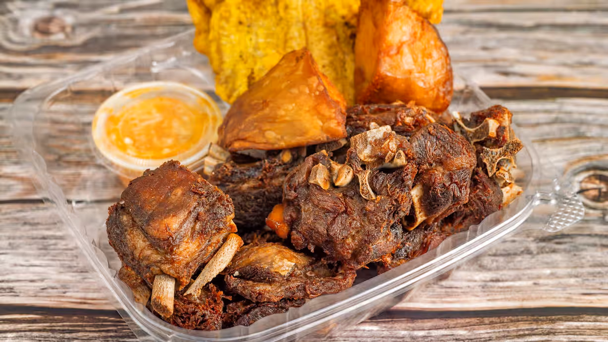 Fried Goat (Cabrit) Platter at PAUL'S UNIQUE GOURMET in MIAMI, FL 33168 | YourMenu Online Ordering