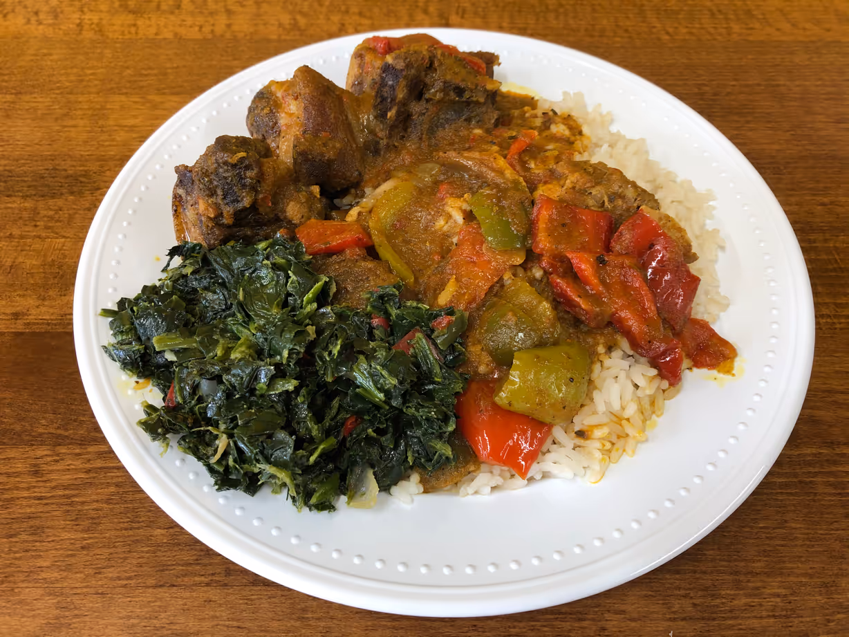 Curry goat w/ rice & a side at Jodeem African Cuisine in Greenbelt, MD 20770 | YourMenu Online Ordering Curry goat w/ rice & a side at Jodeem African Cuisine in Greenbelt, MD 20770 | YourMenu Online Ordering