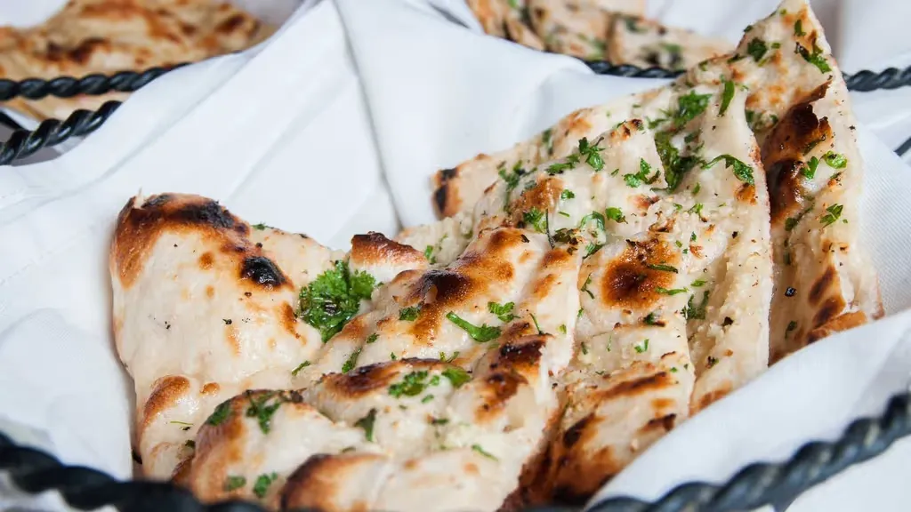 Garlic Cilantro Naan at Heritage India in Washington, DC 20016-3806 | YourMenu Online Ordering Garlic Cilantro Naan at Heritage India in Washington, DC 20016-3806 | YourMenu Online Ordering